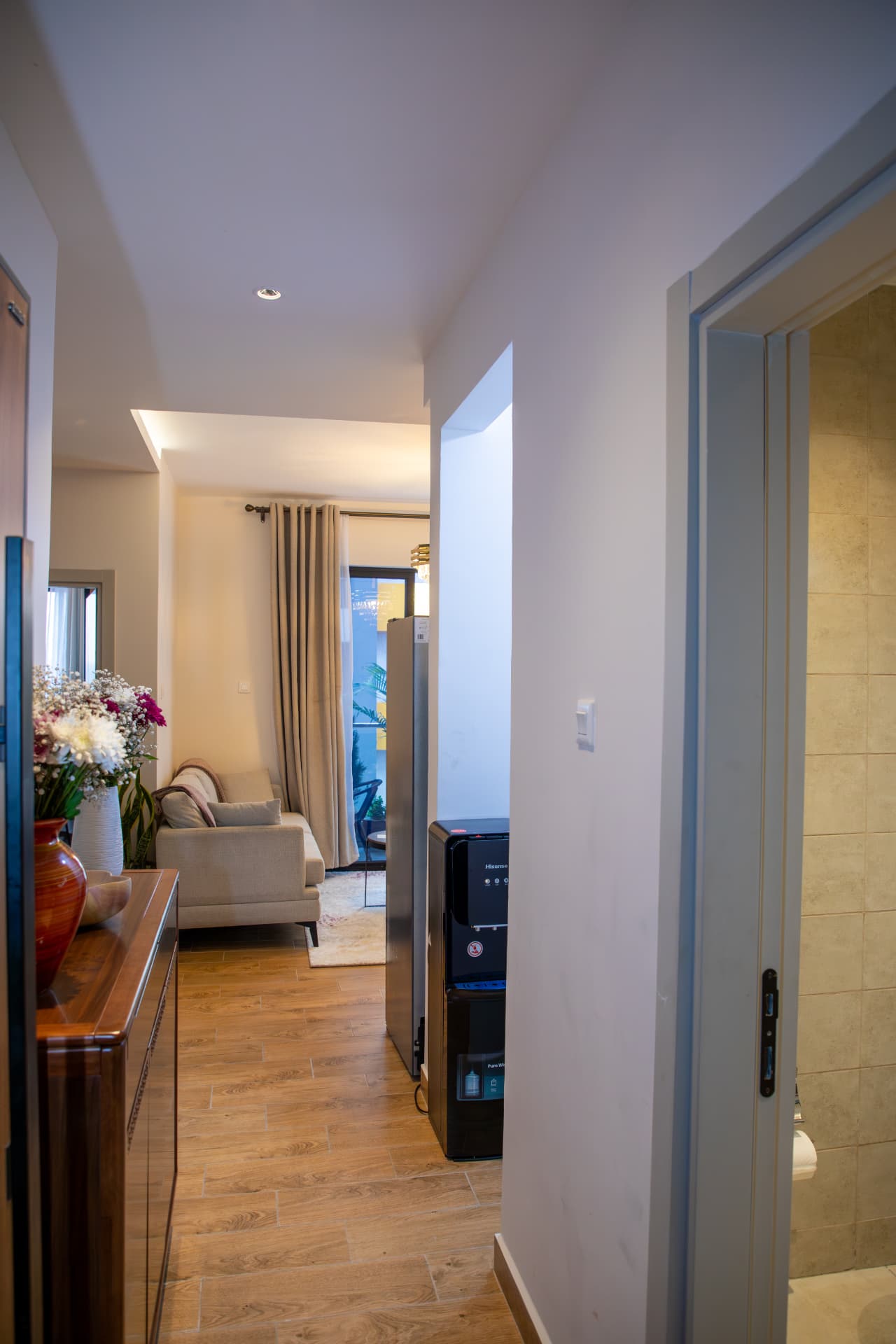 Entry hall looking through to the sofa and balcony