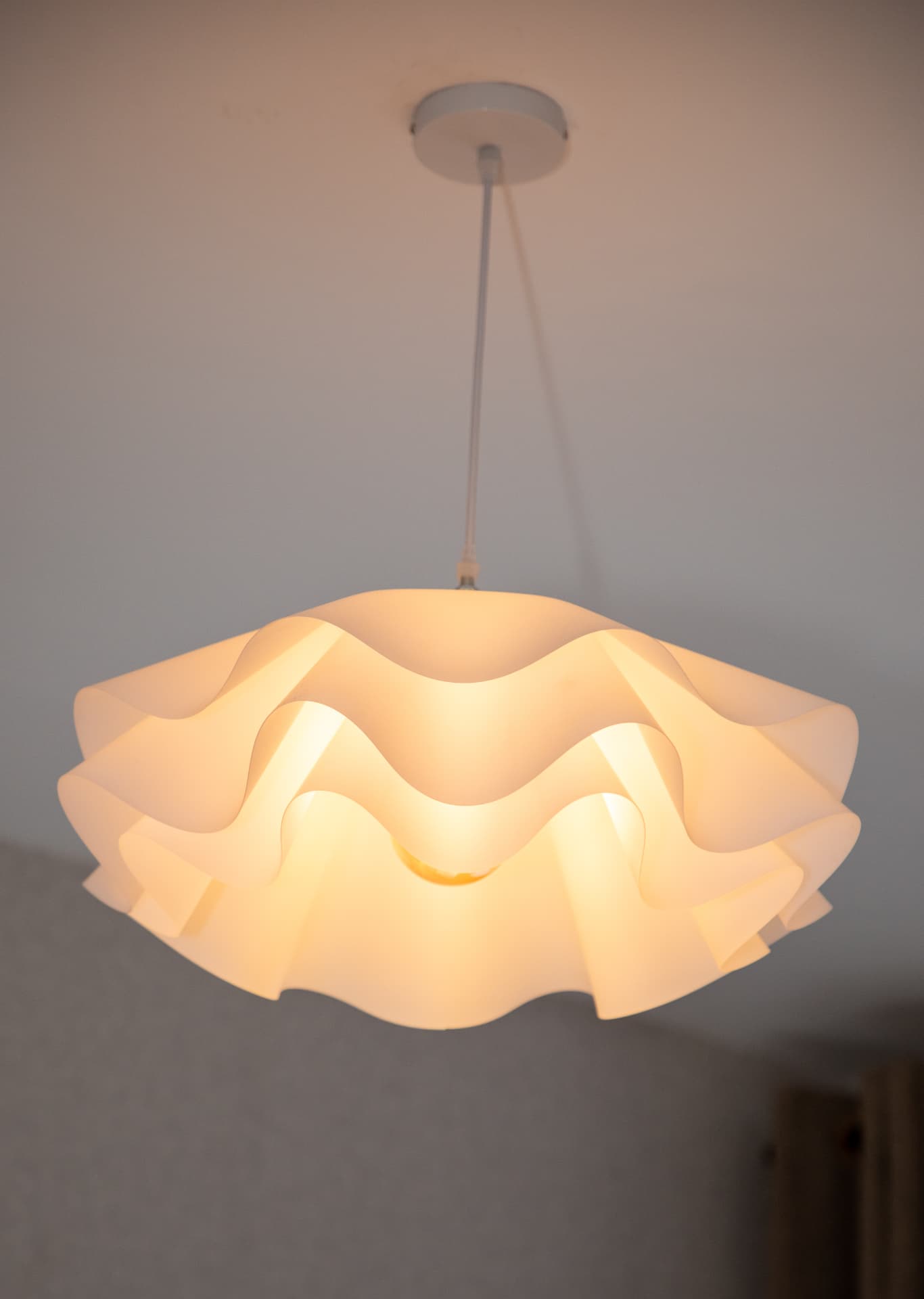 Sculptural wave pendant light