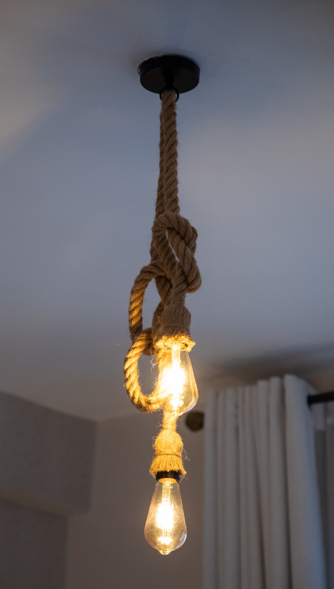 Rope pendant light with exposed bulbs
