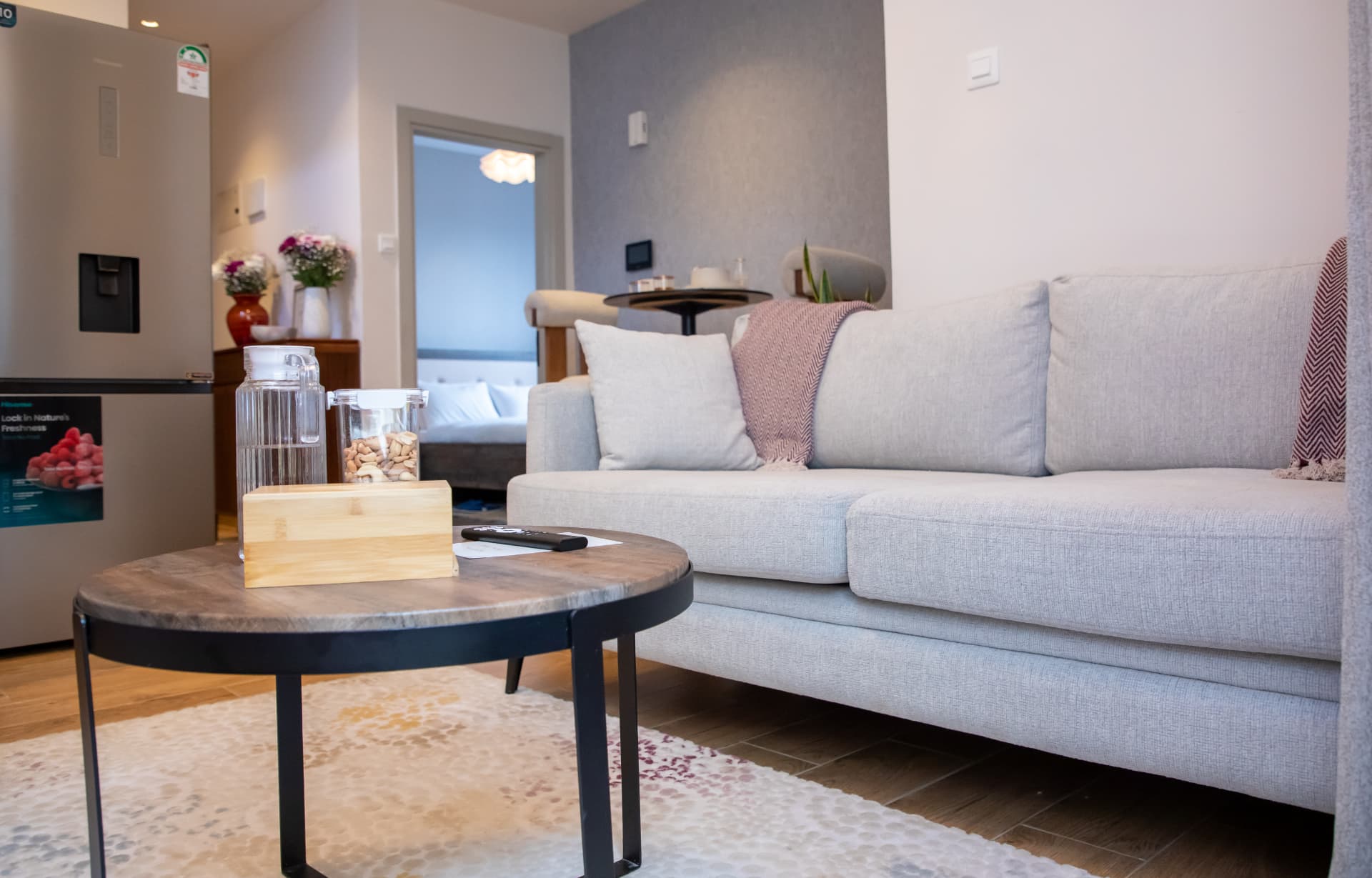 Sofa and round coffee table on a patterned rug