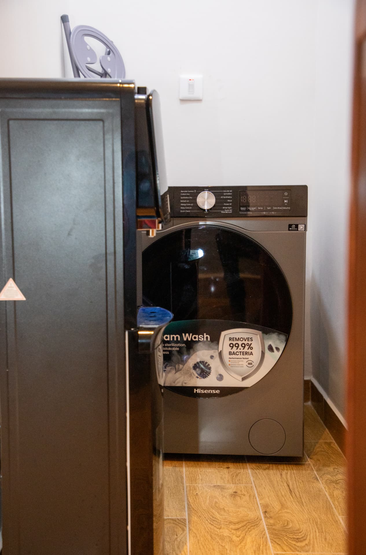 In-unit washing machine in the utility cupboard