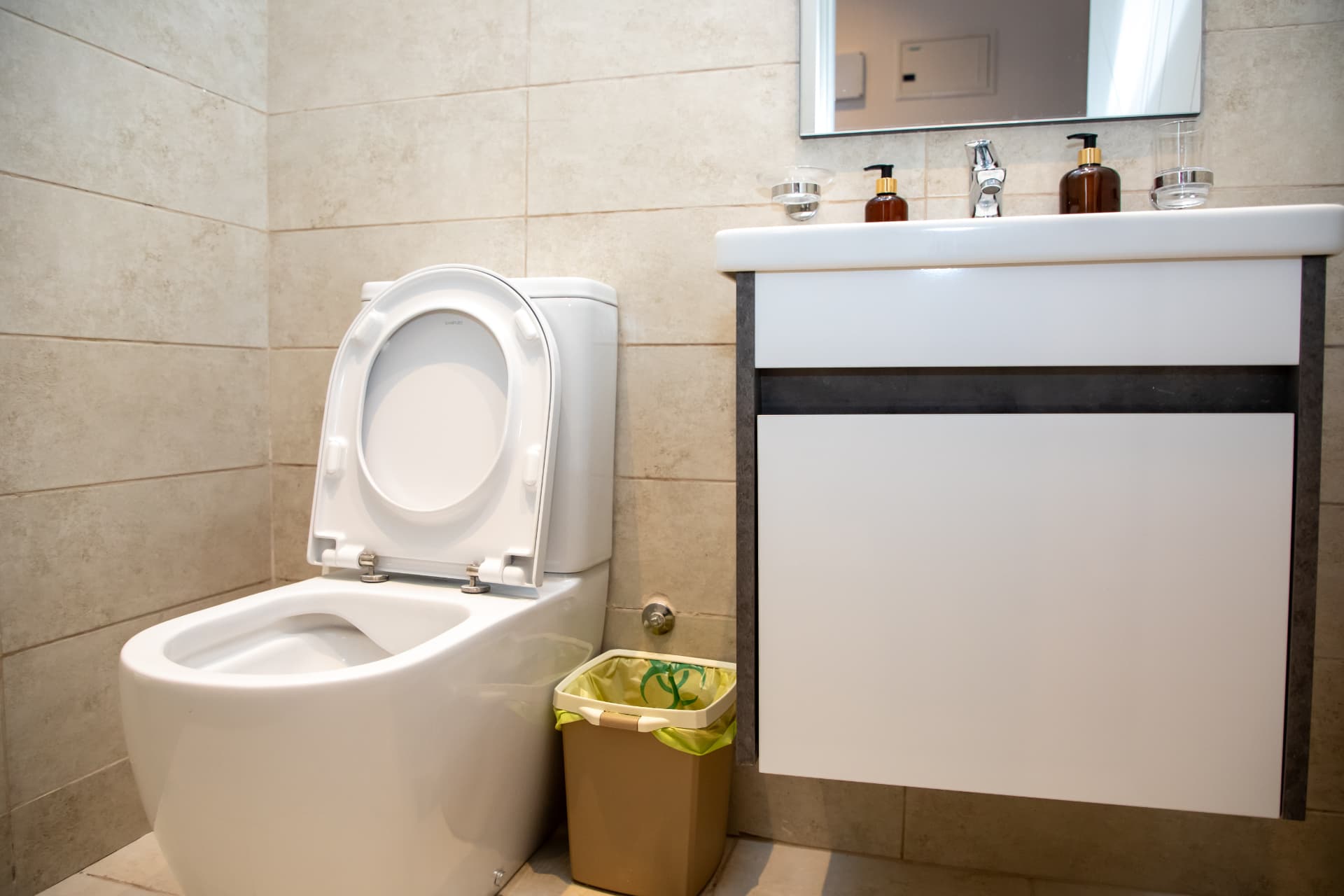 Bathroom vanity with mirror and folded towels