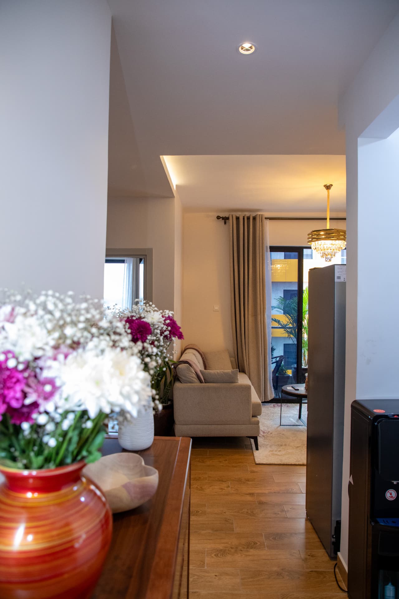 Flowers on the hall console looking into the living room