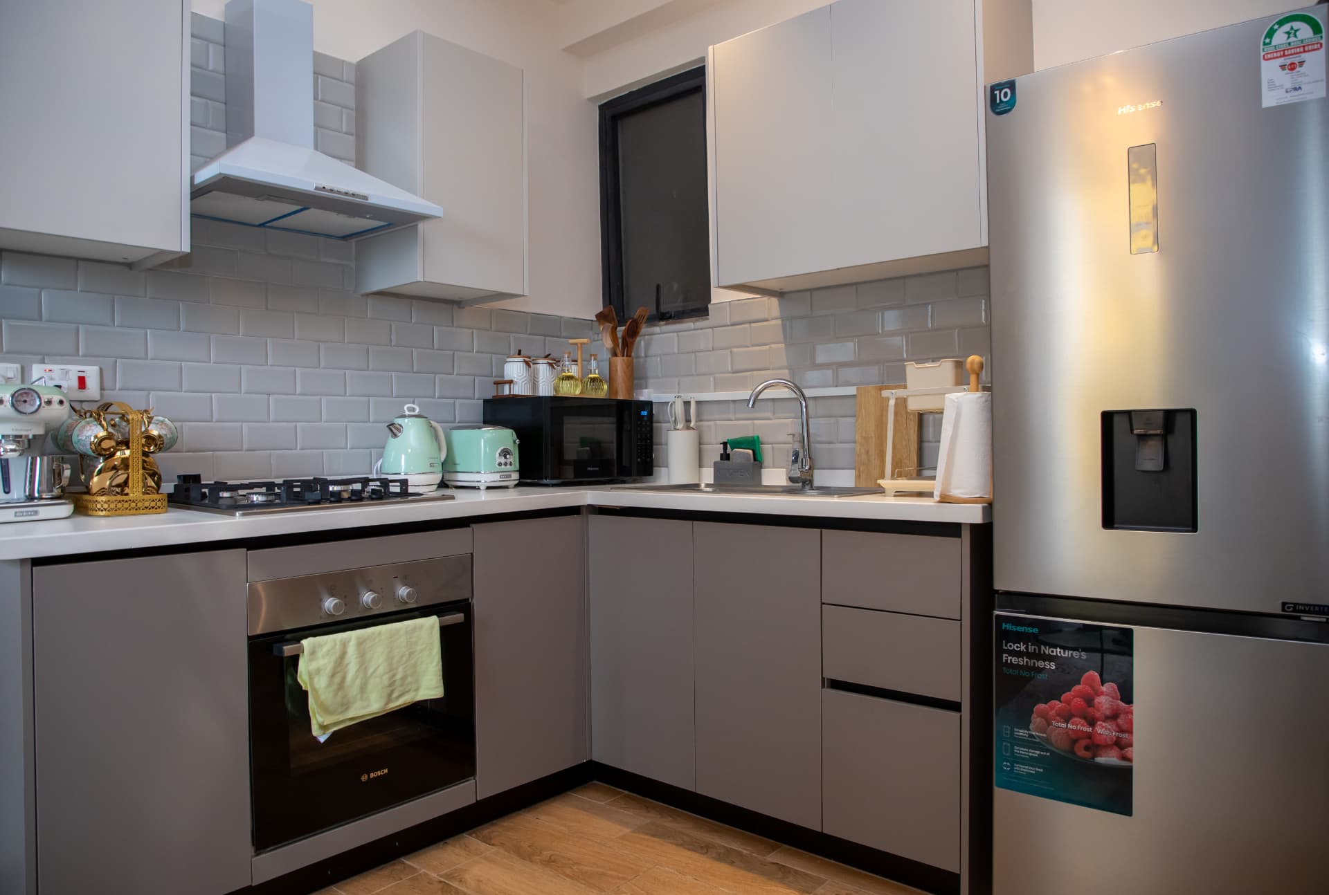 Corner kitchen with oven, extractor and retro appliances