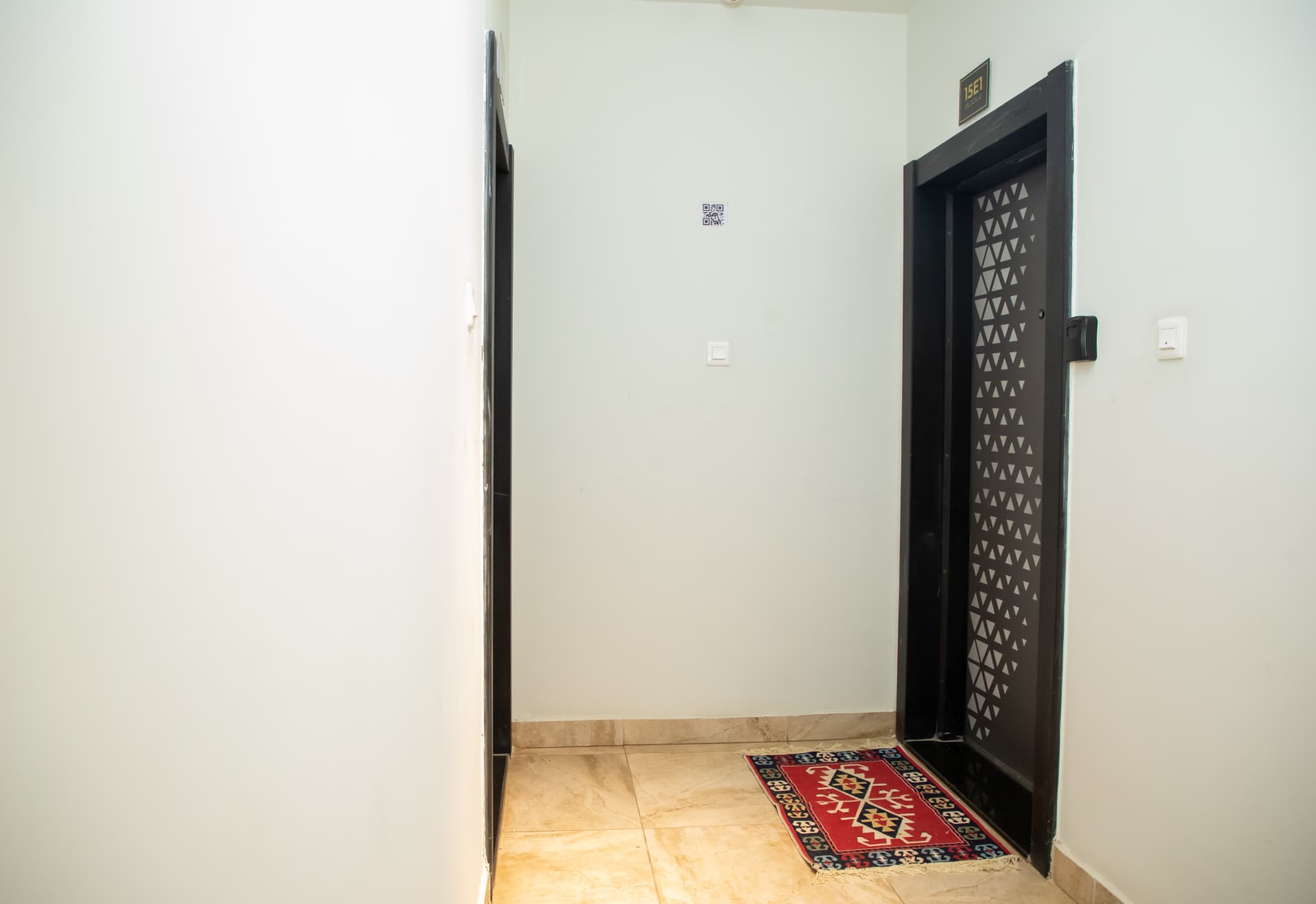 Apartment door with a welcome mat